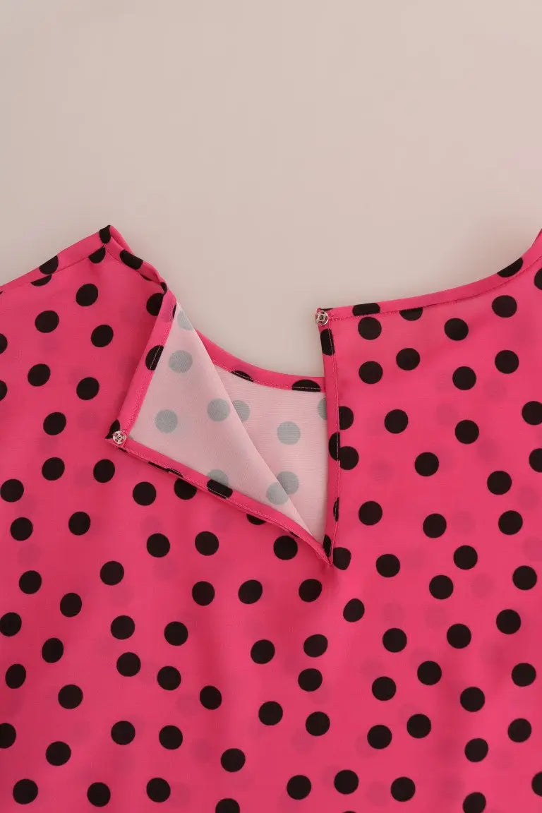 Blouse en soie dolce & gabbana rose vif à pois noirs avec doublure grise à pois blancs visible au col