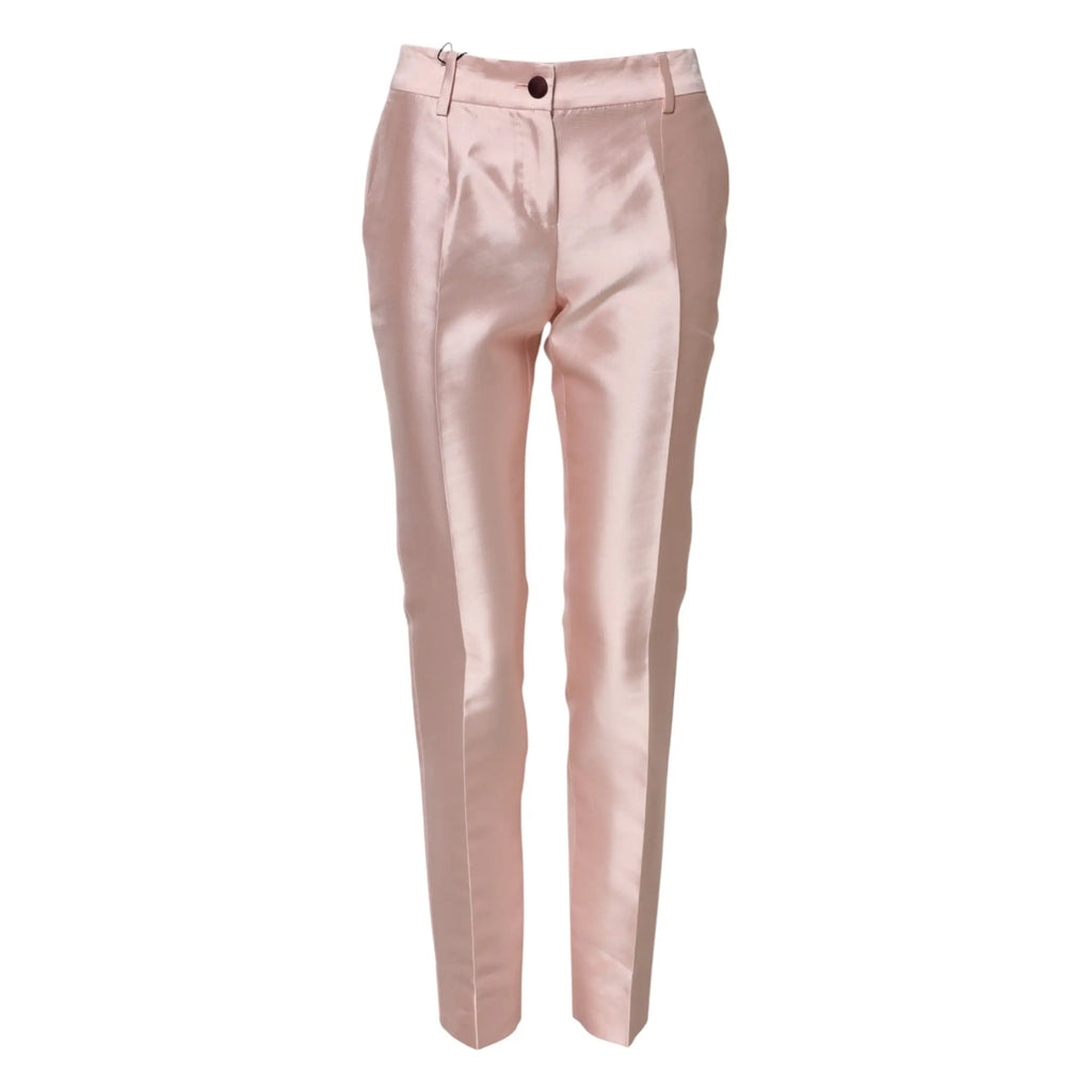 Une paire de pantalons roses en satin blush dolce & gabbana avec une coupe ajustée classique et une finition brillante