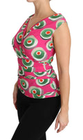 Dolce and gabbana top sans manches en soie stretch rose avec motif géométrique de cercles concentriques verts blancs et orange