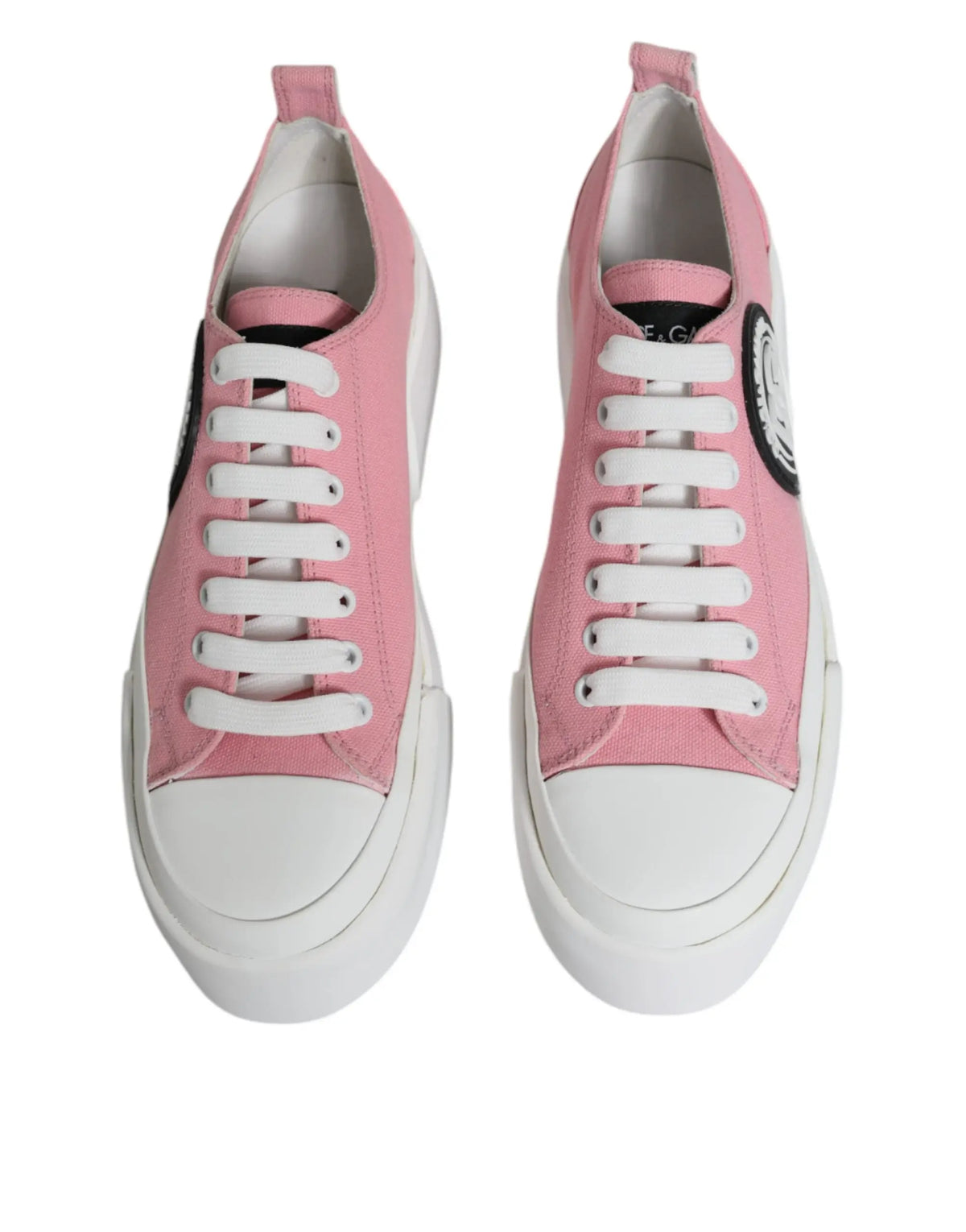 Baskets basses dolce & gabbana en toile rose avec lacets blancs et logo noir circulaire sur le côté