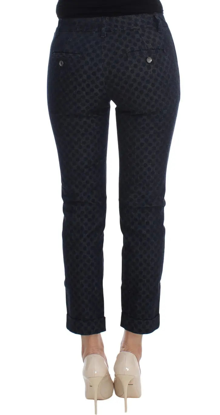 Vue arrière de jean slim capris dolce & gabbana en denim bleu foncé avec pois noirs discrets et boutons argentés