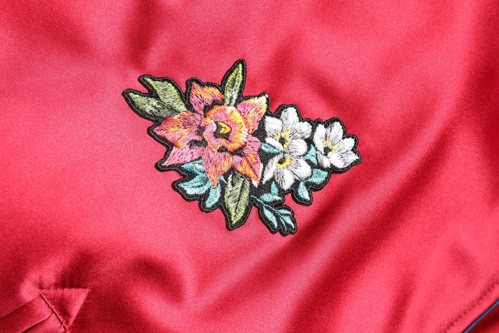 Veste bomber homme dolce & gabbana rouge en satin avec patch floral brodé détail rose pêche blanc et vert