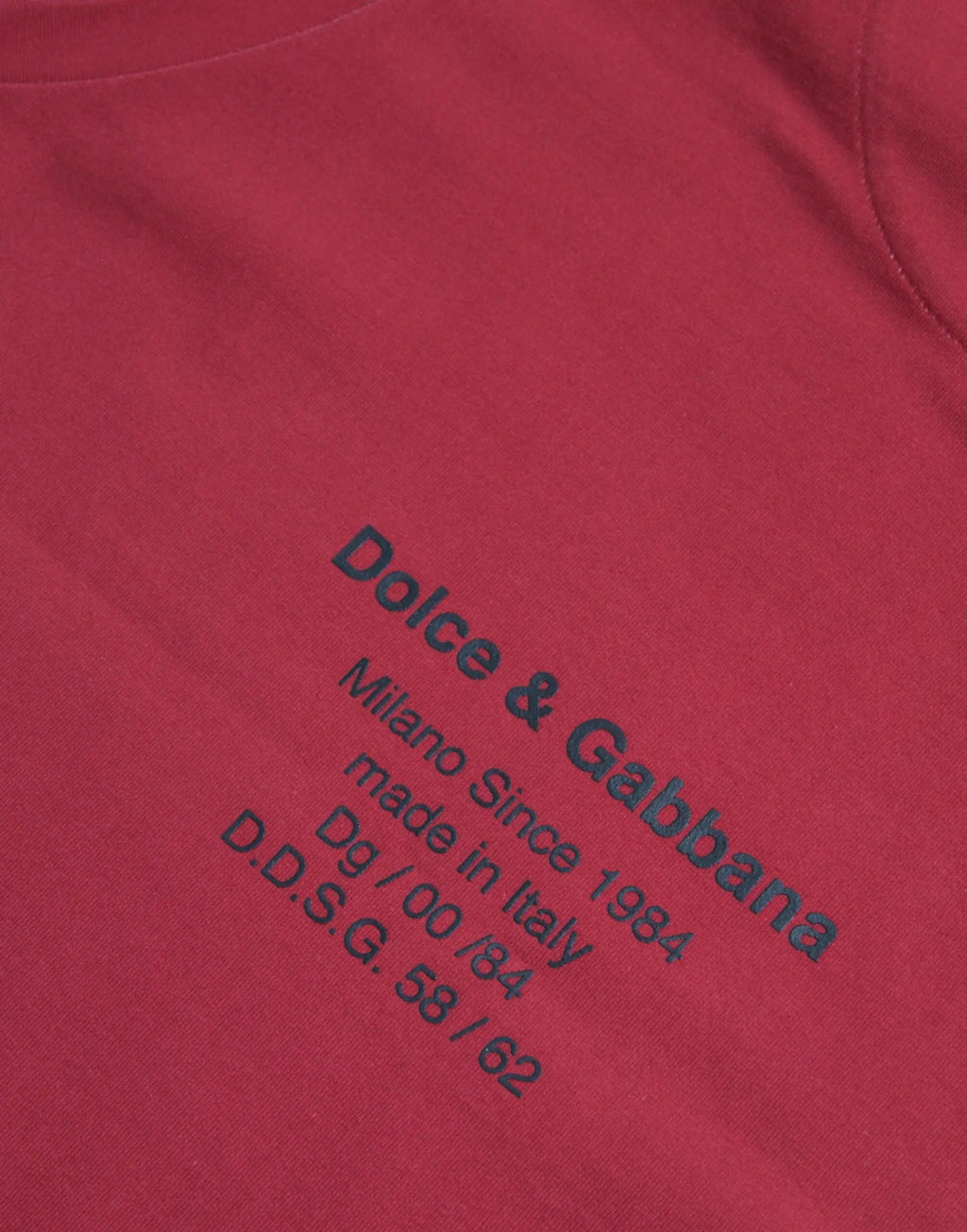 Red sleeveless cotton tank t-shirt by dolce & gabbana with black embroidered text and leopard print design