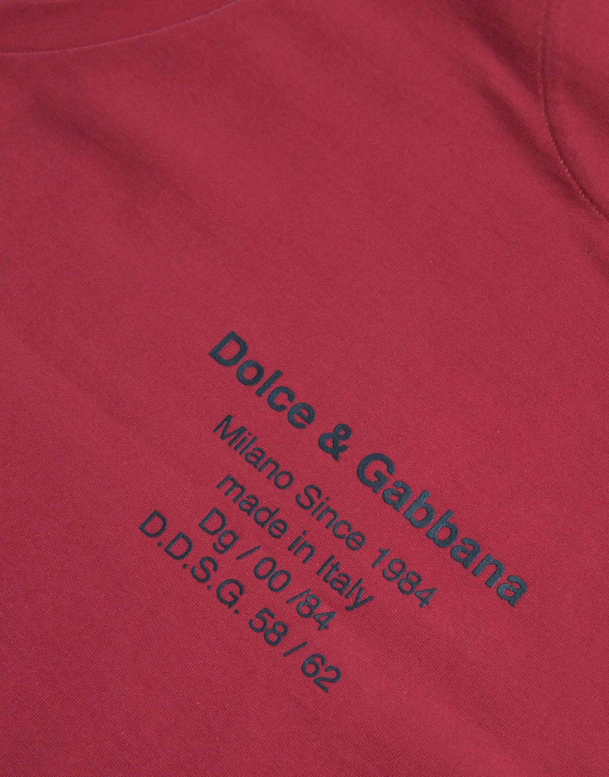 Red sleeveless cotton tank t-shirt by dolce & gabbana with black embroidered text and leopard print design
