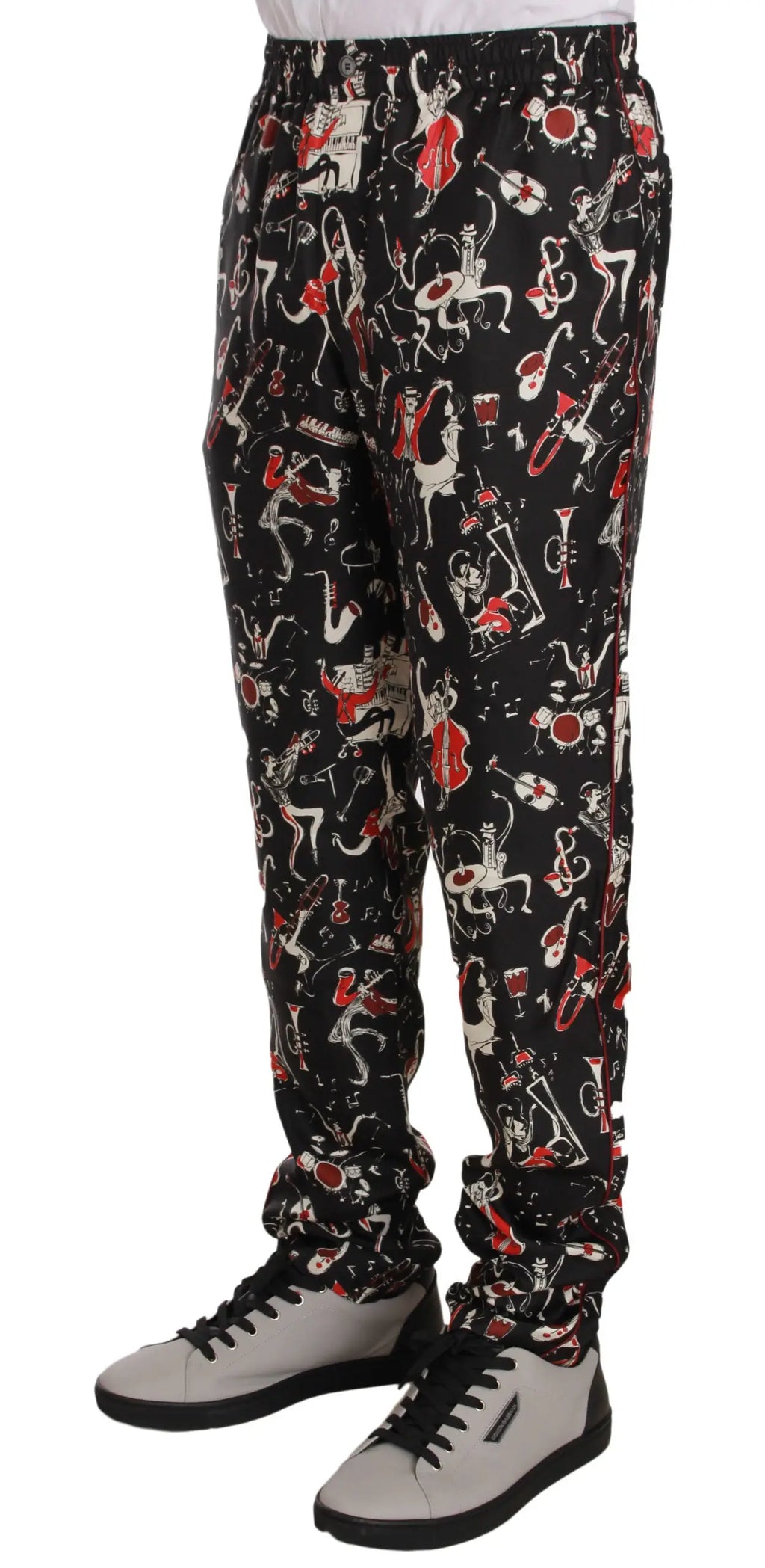 Pantalon noir dolce & gabbana avec imprimé coloré rouge et blanc de personnages et instruments de musique