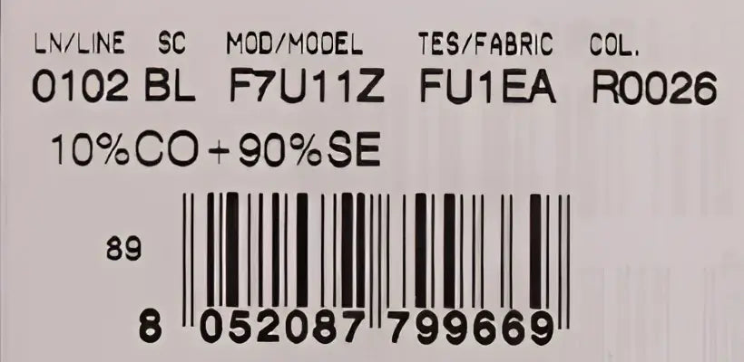 Étiquette au dos d un top dolce & gabbana rouge en soie 10% coton 90% soie avec vase orange et détails en cristal