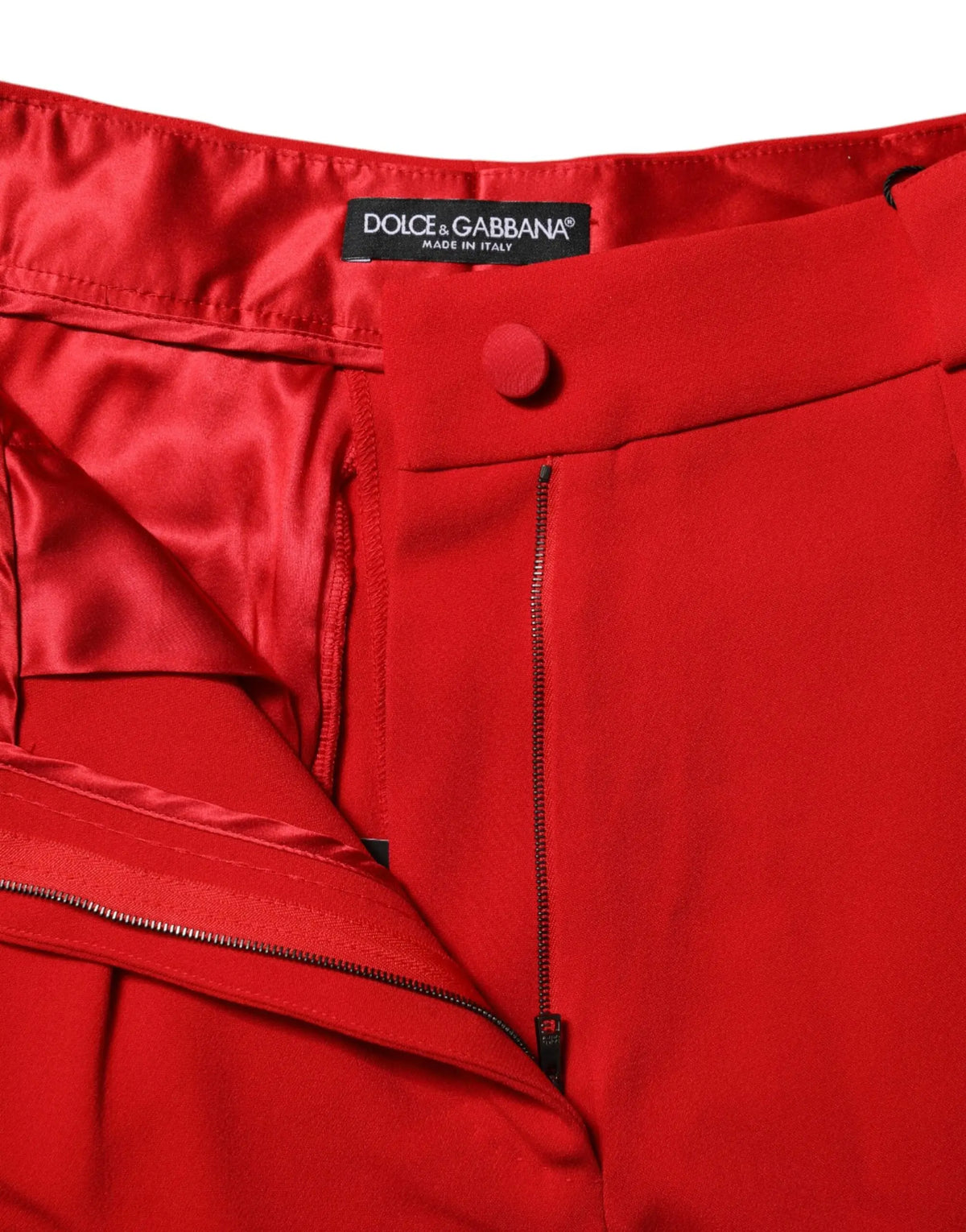 Pantalon rouge en viscose dolce & gabbana taille haute coupe fuselée avec fermeture boutonnée et zips visibles