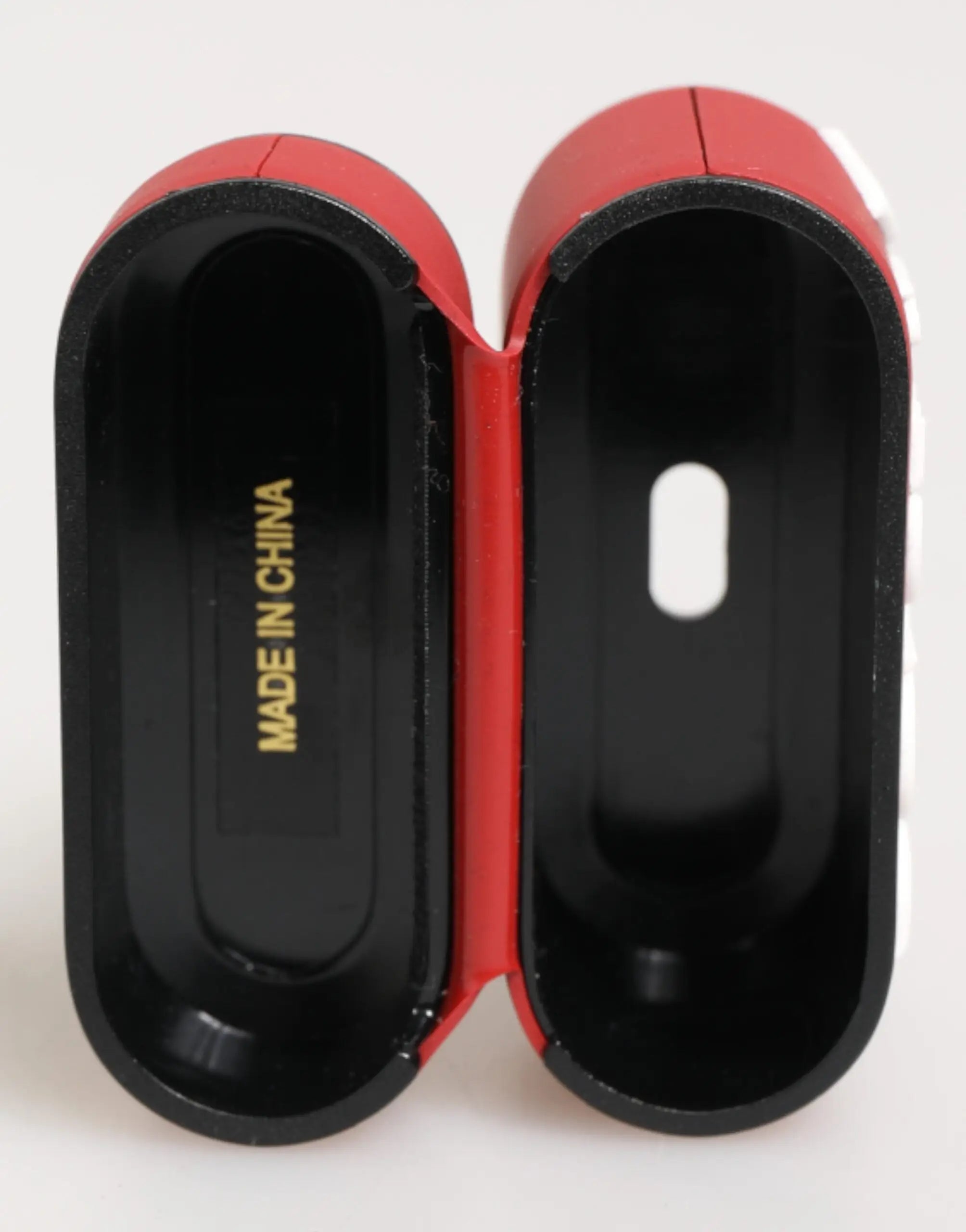 Étui pour airpods dolce & gabbana rouge et noir en silicone avec logo embossé et compartiments moulés