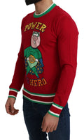 Dolce & gabbana pull rouge en laine et soie avec motif super-héros cochon en vert et or bordure verte et blanche