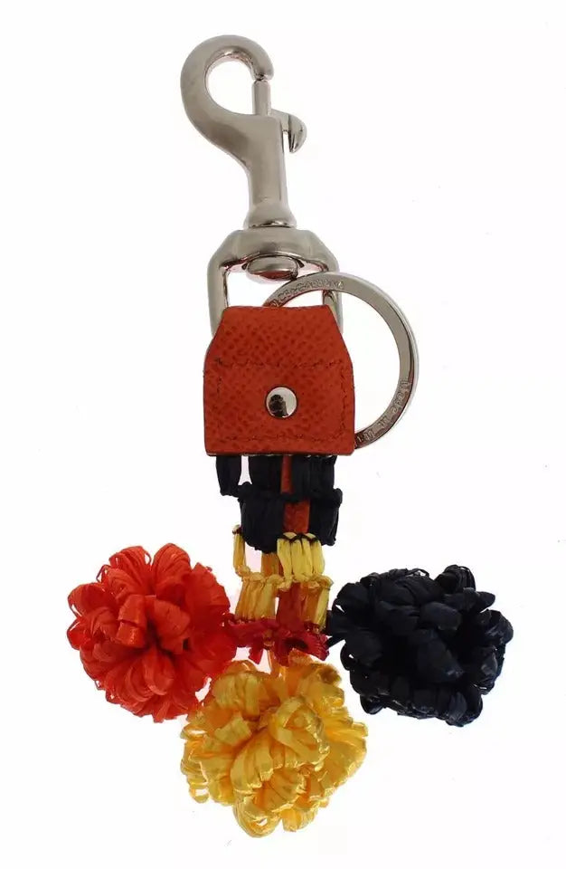Keyring en cuir orange dolce & gabbana avec pompons rouges jaunes et noirs pour retrouver les clés
