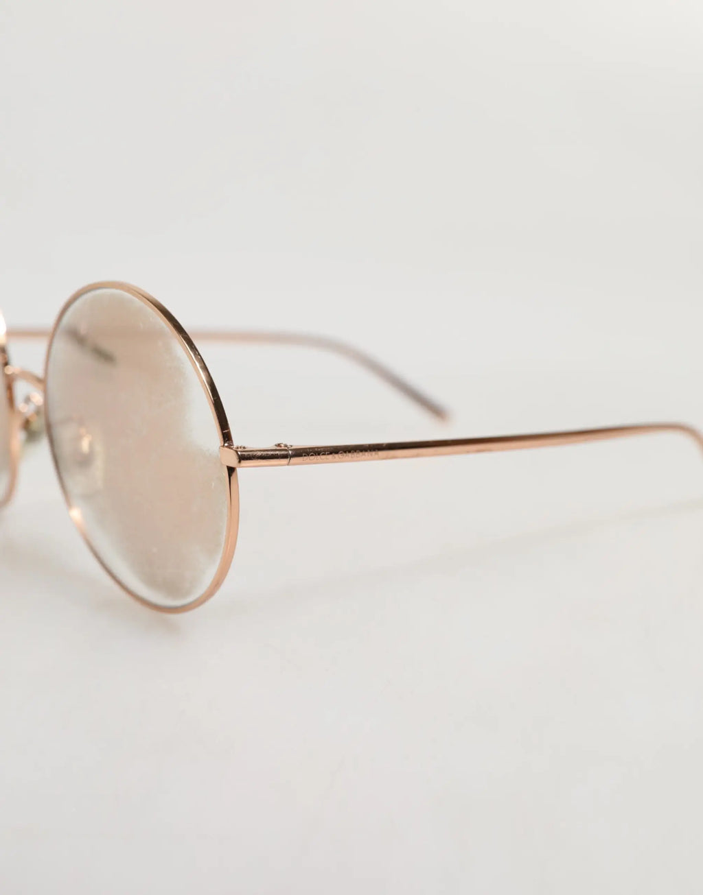 Lunettes de soleil dolce & gabbana à monture ronde plaquée or rose avec verres légèrement teintés