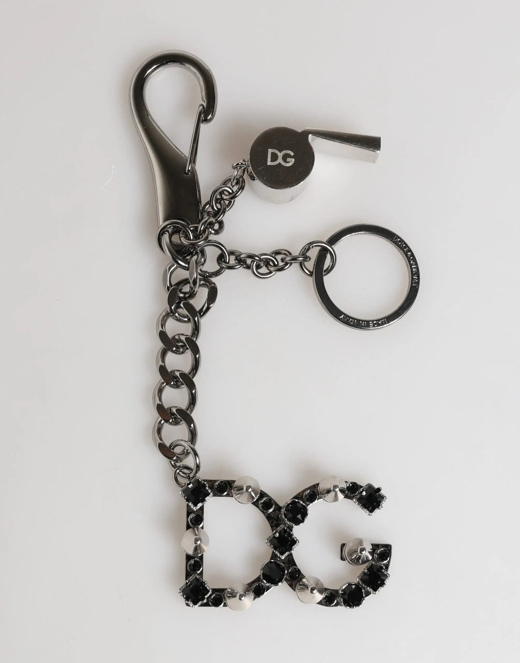 Porte-clés dolce & gabbana en laiton argenté avec chaîne noire, motif crâne et logo dg en cristal