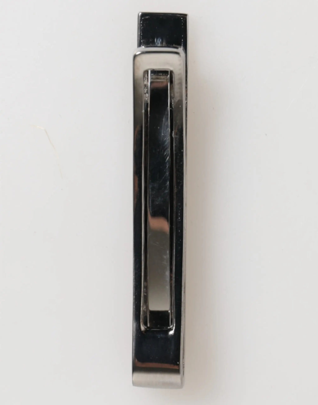 Chrome-finished metal drawer pull with sleek rectangular design and recessed grip for dolce gabbana silver tone brass tie clip