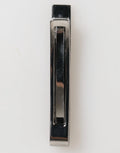 Chrome-finished metal drawer pull with sleek rectangular design and recessed grip for dolce gabbana silver tone brass tie clip