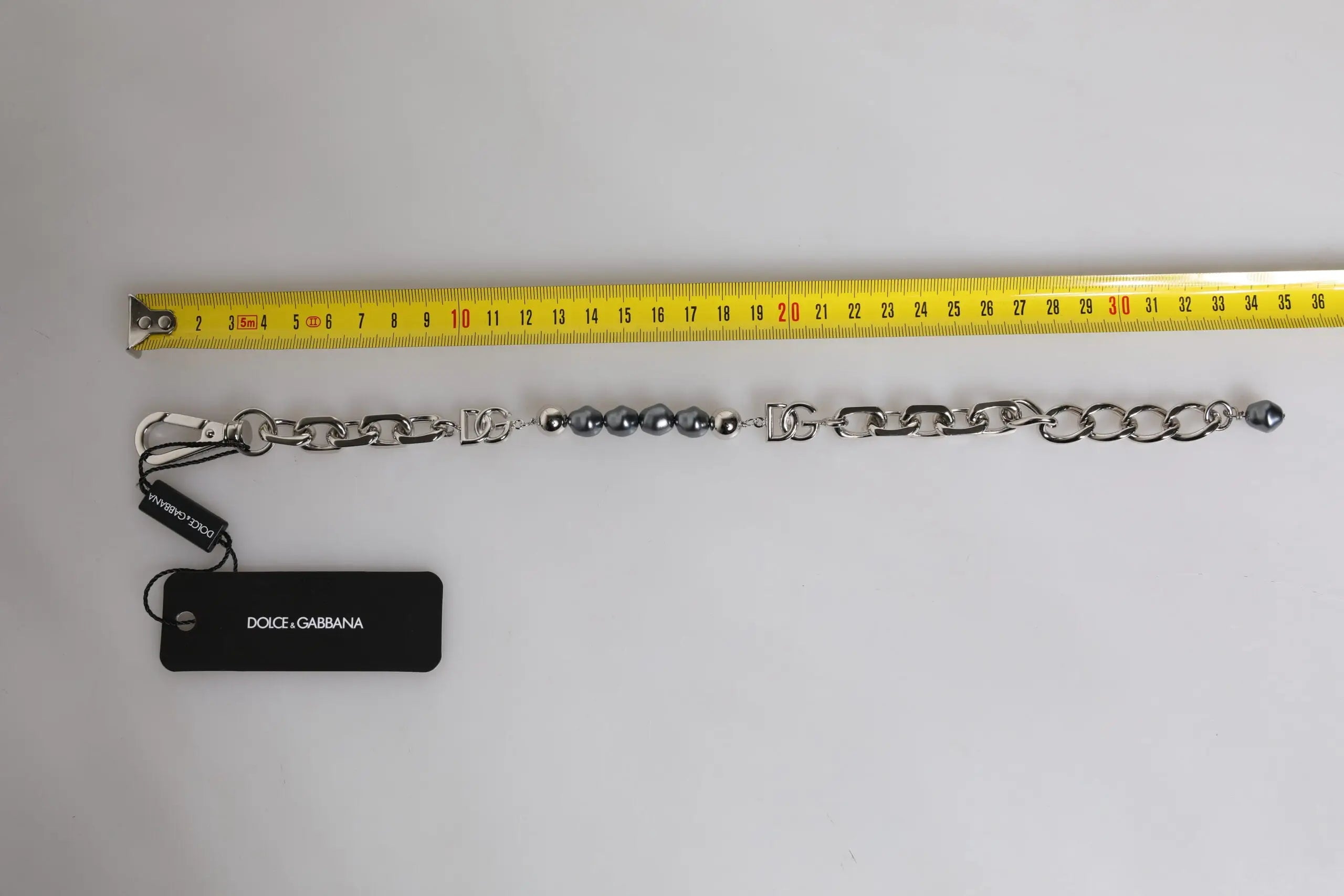 Bracelet dolce & gabbana argenté avec maillons entrelacés perles grises et fermoir homard logo