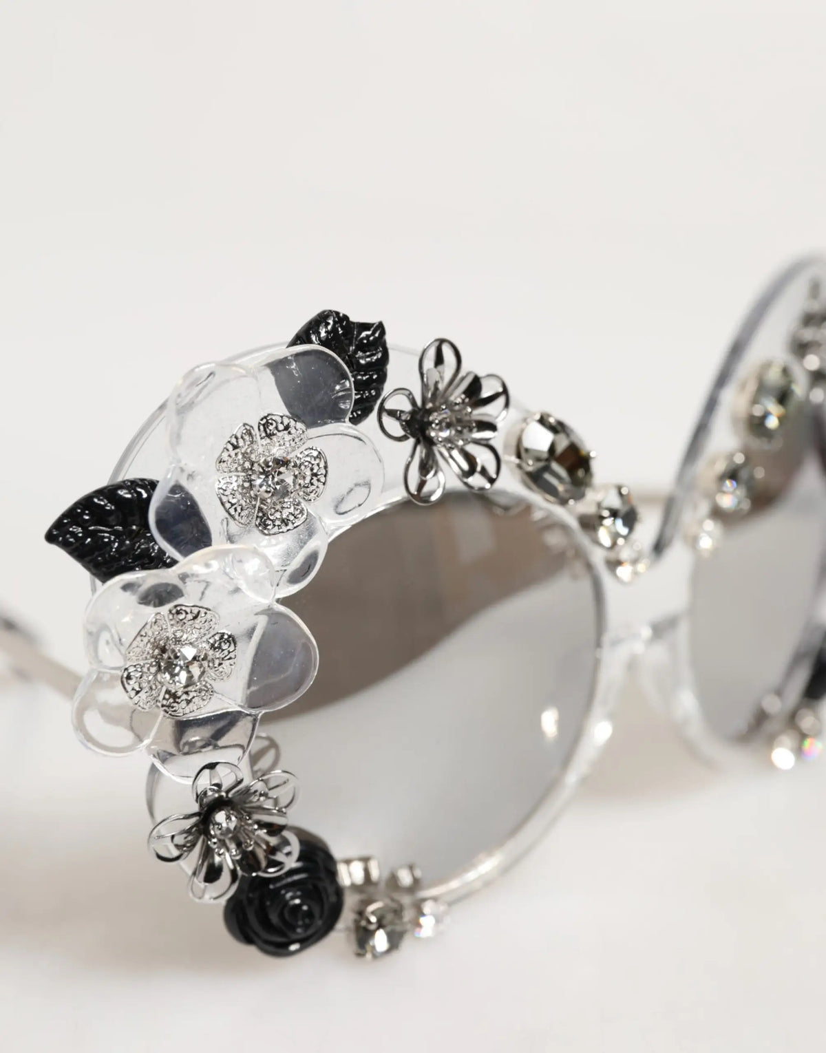 Lunettes de soleil rondes transparentes dg4292 de Dolce & Gabbana en acétate clair avec fleurs noires et argentées