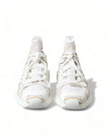 Baskets montantes dolce & gabbana blanc beige avec design moderne et accents dorés subtils sur la pointe et les côtés