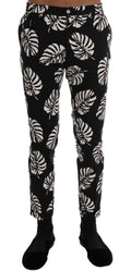 Pantalon slim noir dolce & gabbana en coton stretch avec motif blanc de feuille de monstera bold