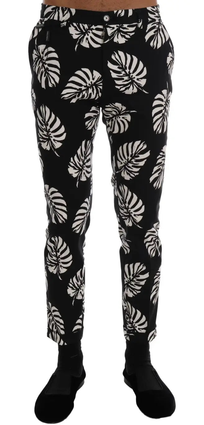 Pantalon slim noir dolce & gabbana en coton stretch avec motif blanc de feuille de monstera bold