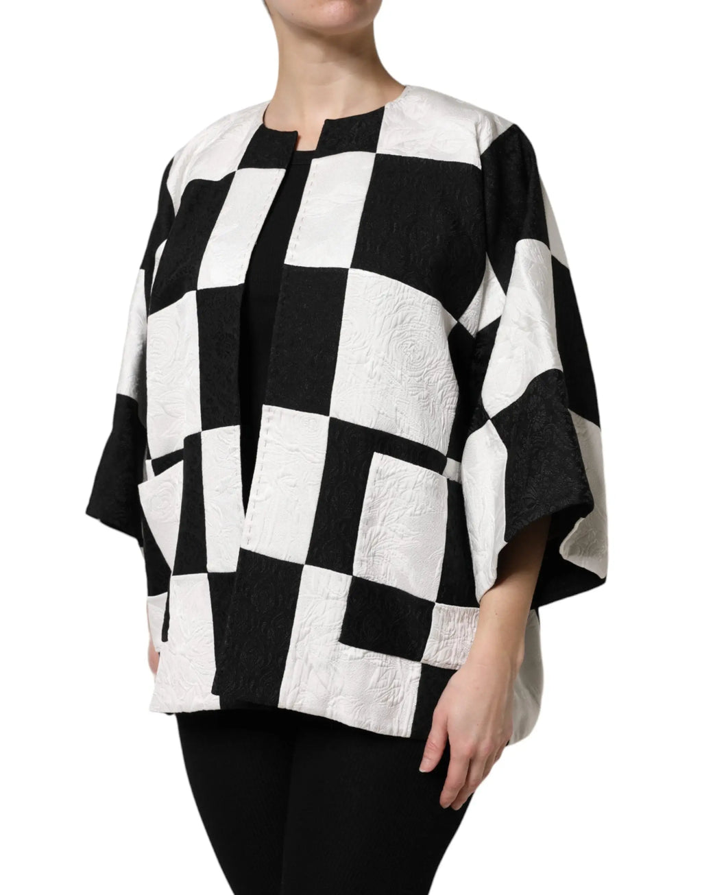 Veste à cape noir et blanc à carreaux en jacquard patchwork dolce & gabbana avec tissu texturé