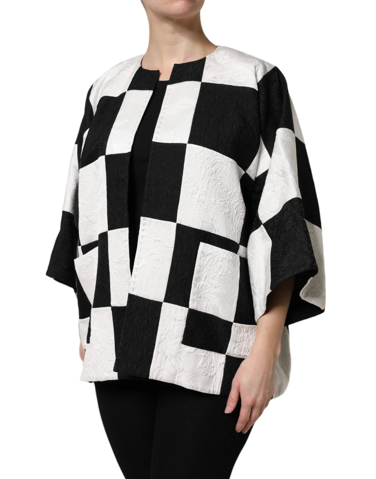 Veste à cape noir et blanc à carreaux en jacquard patchwork dolce & gabbana avec tissu texturé