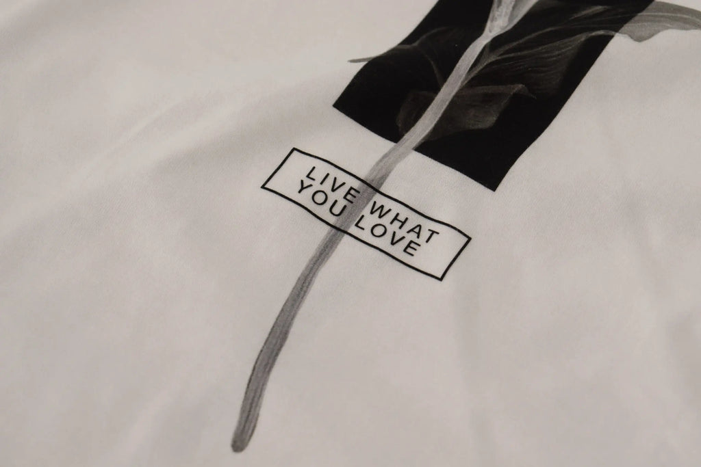 T-shirt dolce & gabbana en coton blanc avec graphique noir et blanc de tige fleurie et texte live what you love