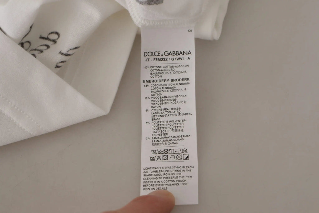 Étiquette blanche dolce & gabbana avec texte noir indiquant la composition et les instructions d entretien pour t shirt coton roses noires