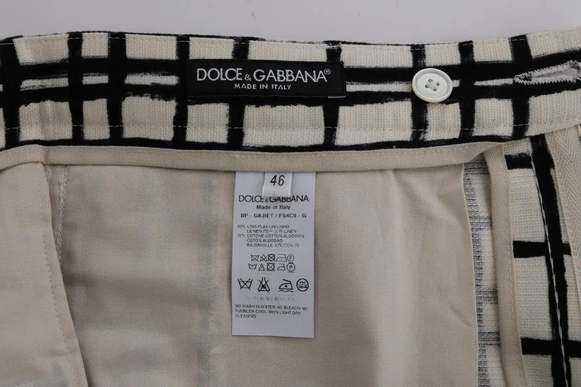 Pantalon dolce & gabbana à carreaux noirs et crème avec fermeture à boutons blancs, modèle décontracté