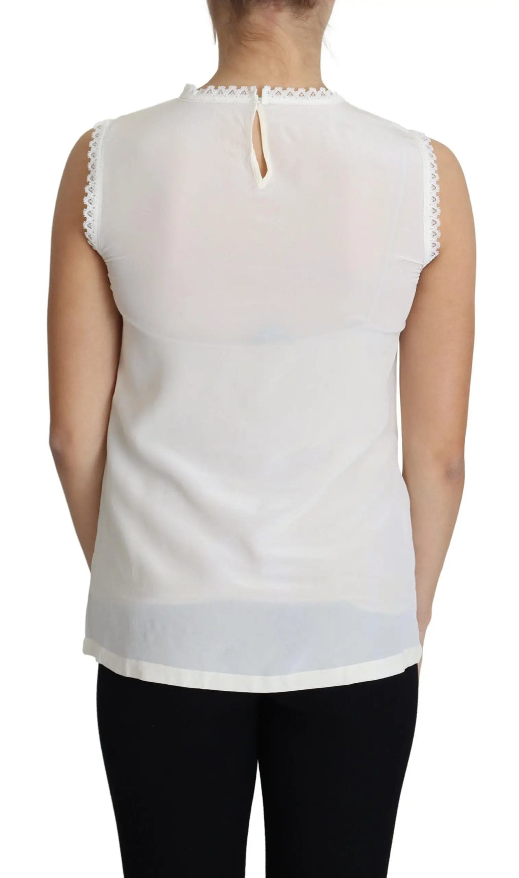 Blouse blanche sans manches dolce & gabbana en soie avec bordure en dentelle délicate au col et aux emmanchures