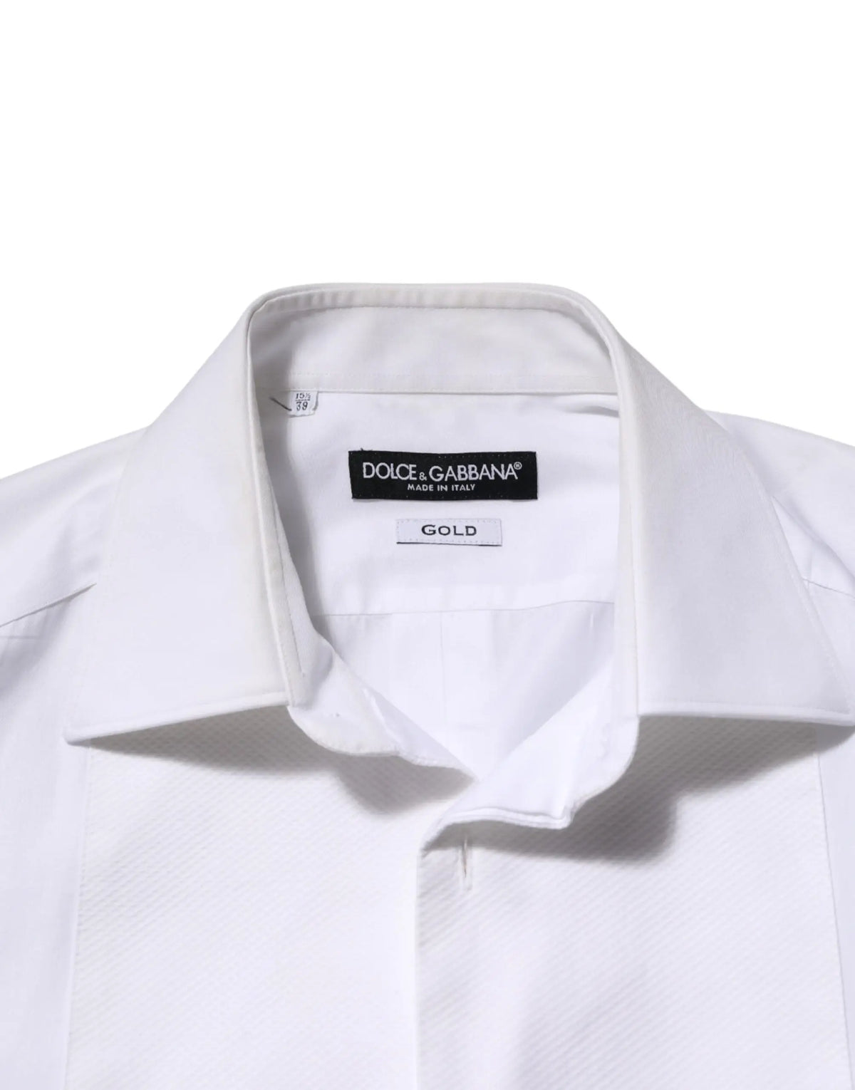 Chemise habillée blanche dolce & gabbana en coton avec col net et étiquette or indiquant le tissu