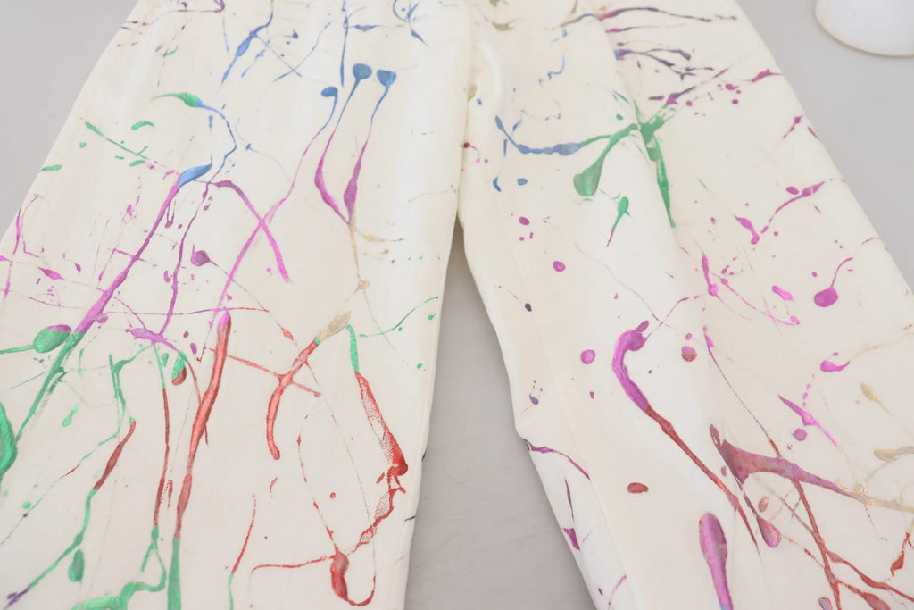 Pantalon en coton blanc dolce gabbana avec éclaboussures de peinture rouge vert bleu violet et rose