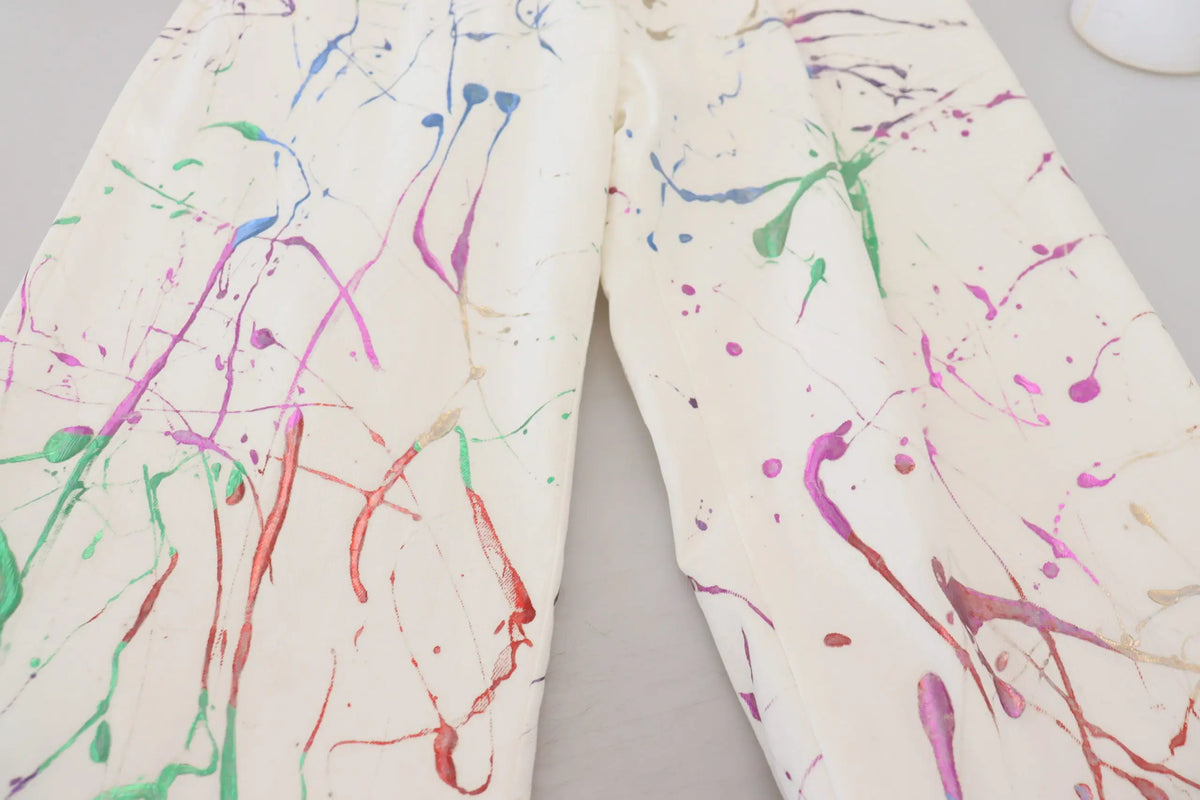 Pantalon en coton blanc dolce gabbana avec éclaboussures de peinture rouge vert bleu violet et rose