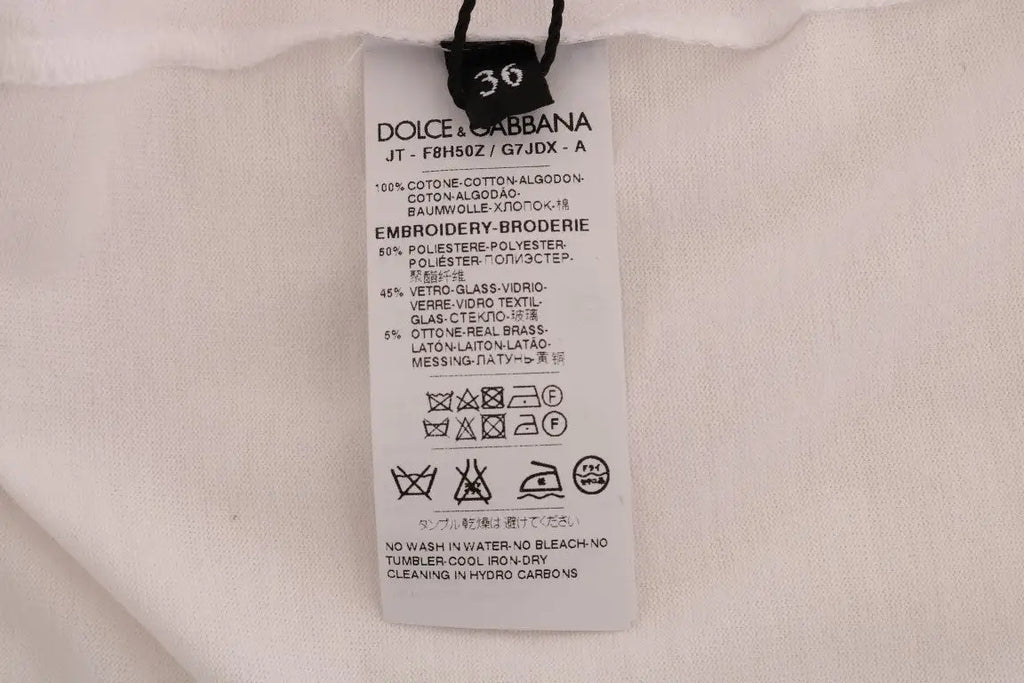 Étiquette blanche dolce & gabbana coton du t-shirt fairy tale avec instructions d’entretien et composition multilingue