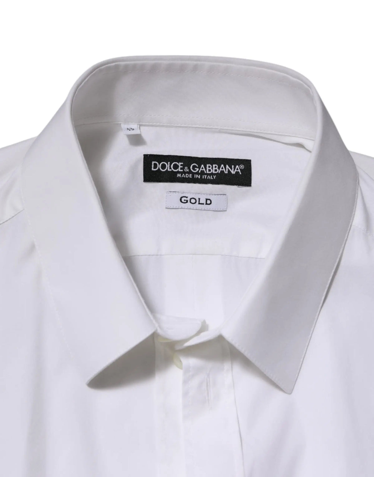 Chemise formelle blanche dolce & gabbana en coton avec col net et étiquette dorée indiquant le tissu