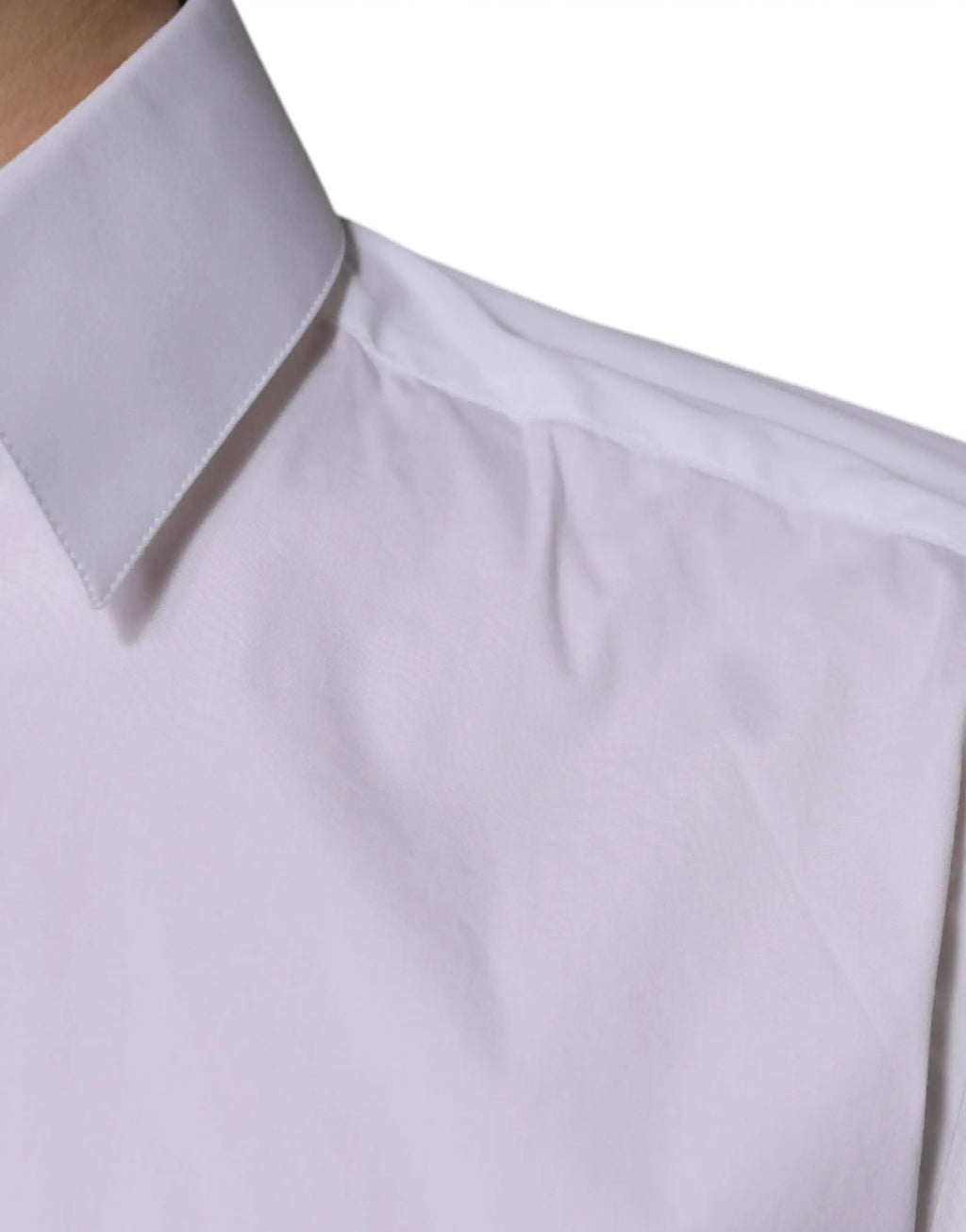 Chemise blanche en coton à manches longues dolce & gabbana avec col plié et légères plis sur le tissu