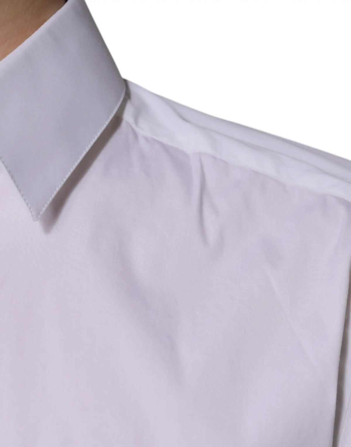 Chemise blanche en coton à manches longues dolce & gabbana avec col plié et légères plis sur le tissu