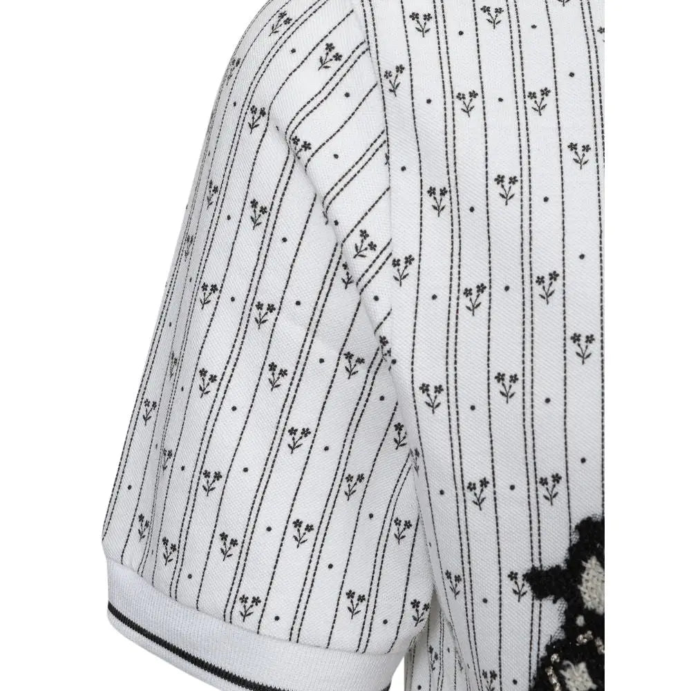 Manche de pull blanc à rayures verticales noires avec petites broderies florales sur polo en coton dolce gabbana