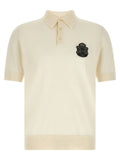 Polo en coton blanc dolce & gabbana avec broderie noire en forme d ecusson sur la poitrine gauche