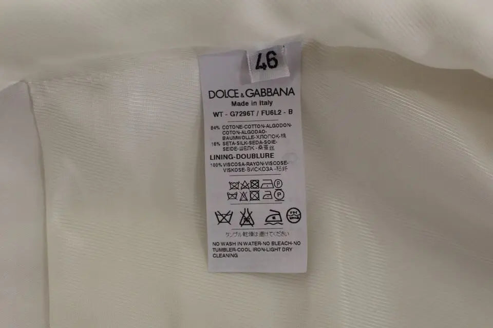 Étiquette d entretien blanche dolce gabbana en coton et soie indiquant fabriqué en italie pour robe veste blazer