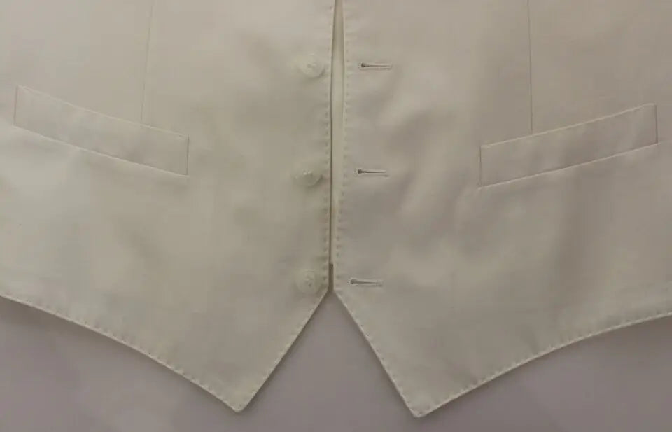 Un gilet en satin crème avec fermeture centrale à boutons et deux poches à rabat dolce & gabbana coton soie