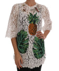 Blouse en dentelle blanche dolce & gabbana avec application ananas en sequins orange et verts et motifs feuilles tropicales brodés