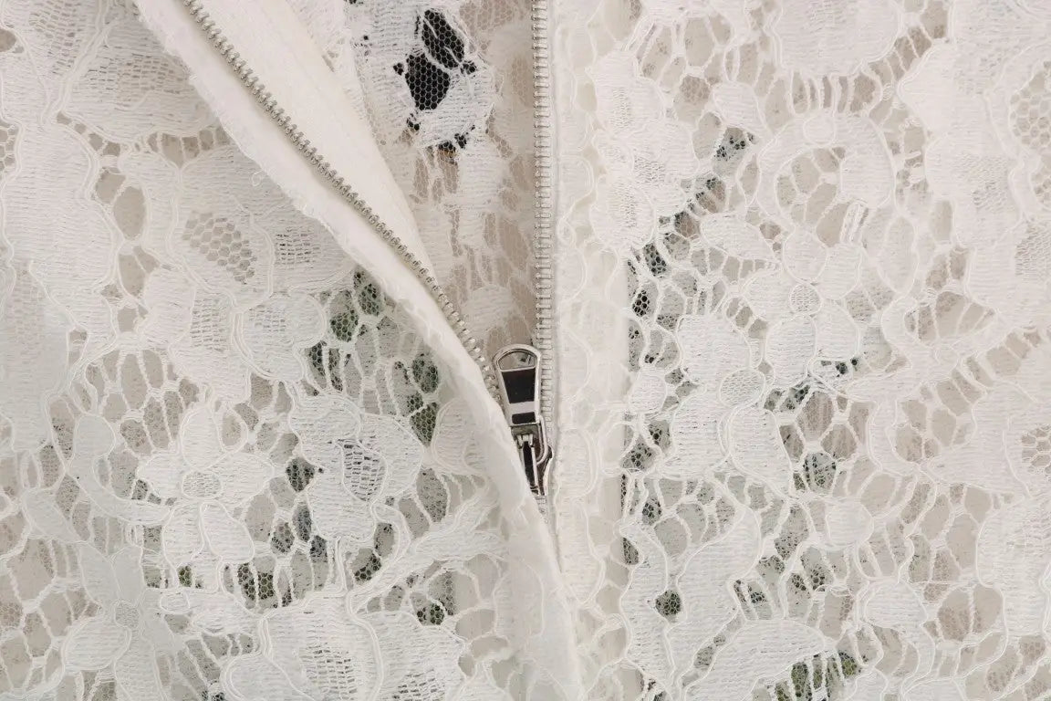 Blouse en dentelle blanche dolce & gabbana avec embellissements en cristal et fermeture éclair argentée
