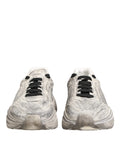 Baskets homme Dolce & Gabbana daymaster low top usées gris argent avec lacets noirs et semelle épaisse gabban sur la languette