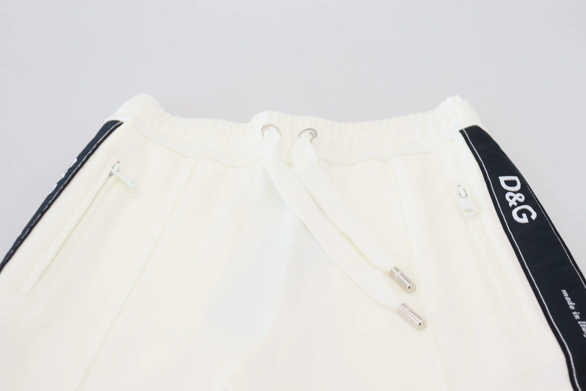 Dolce gabbana white dg logo sweatpants with black side stripes and silver toned drawstring hardware