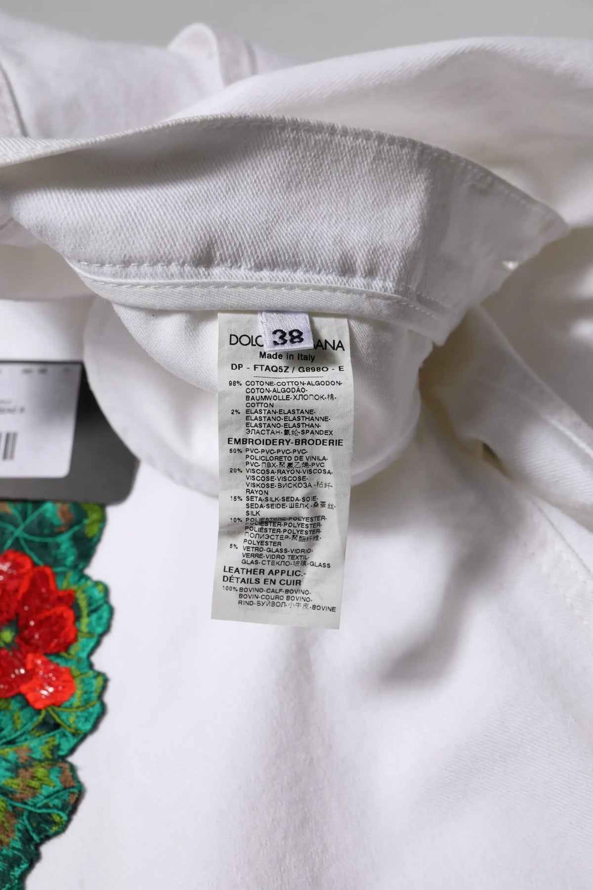 Jean denim blanc en coton avec broderie florale dolce & gabbana et étiquette visible