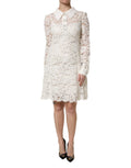 Robe ivoire en dentelle florale dolce & gabbana avec col classique manches longues et jupe évasée
