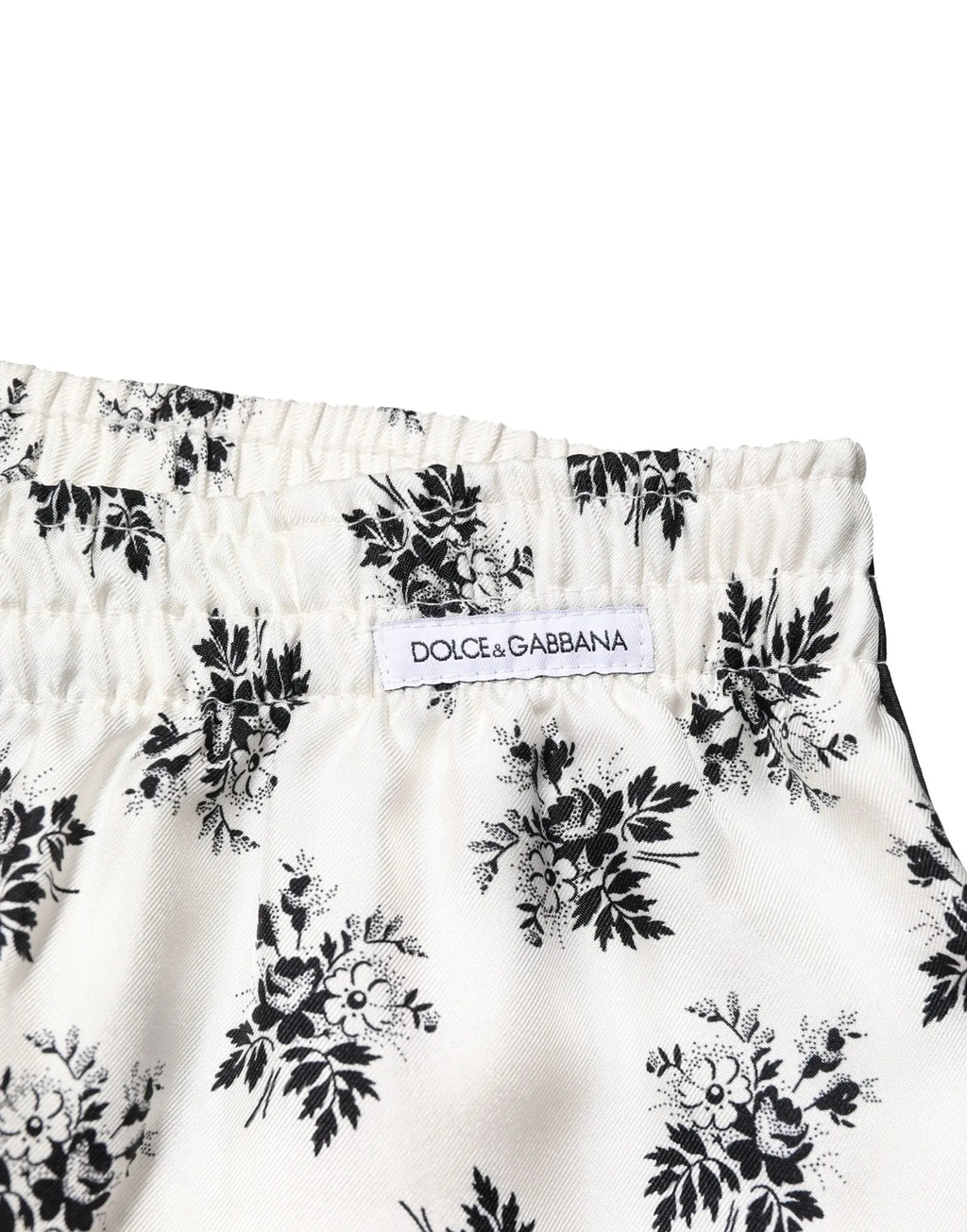 Dolce & gabbana white floral silk casual lounge pants featuring white shorts with a black floral pattern