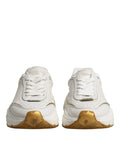 Baskets basses dolce & gabbana daymaster blanches en cuir avec détails dorés et semelle épaisse logo sur la languette
