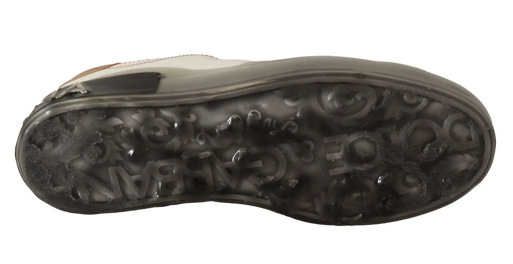 Semelle extérieure en caoutchouc noir avec motif de logo embossé des baskets basses blanches en cuir blanc or dolce & gabbana