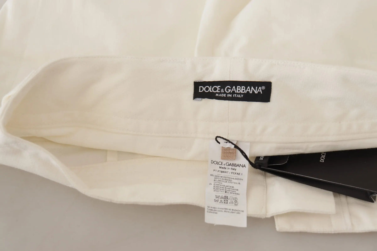 Chemise crème dolce gabbana en coton avec étiquette noire et étiquette d’entretien sur pantalon blanc taille haute femme